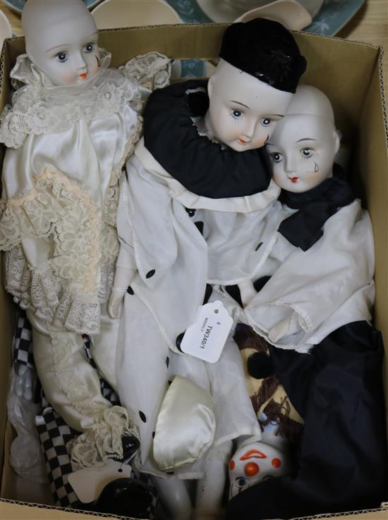 Three Pierrot bisque porcelain and cloth boudoir dolls and two similar clown dolls